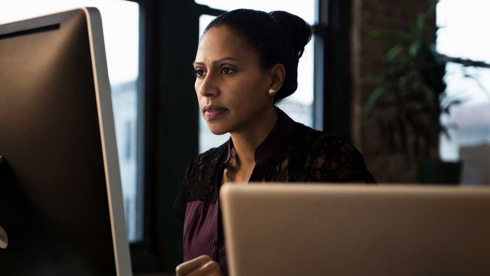 person-in-office-on-computer-thumbnail