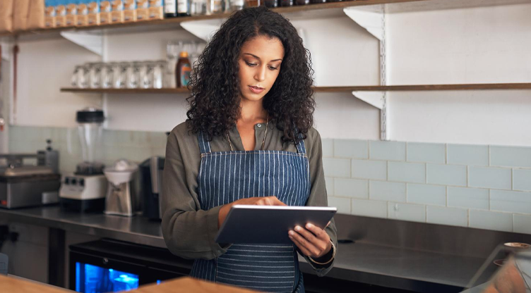 Resturant owner on her iPad