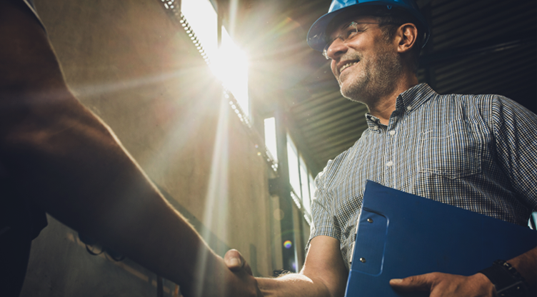construction worker shaking someones hand