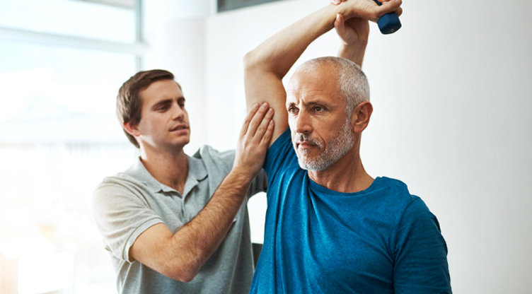 man doing psychotherapy on his shoulder with a dumbbell_