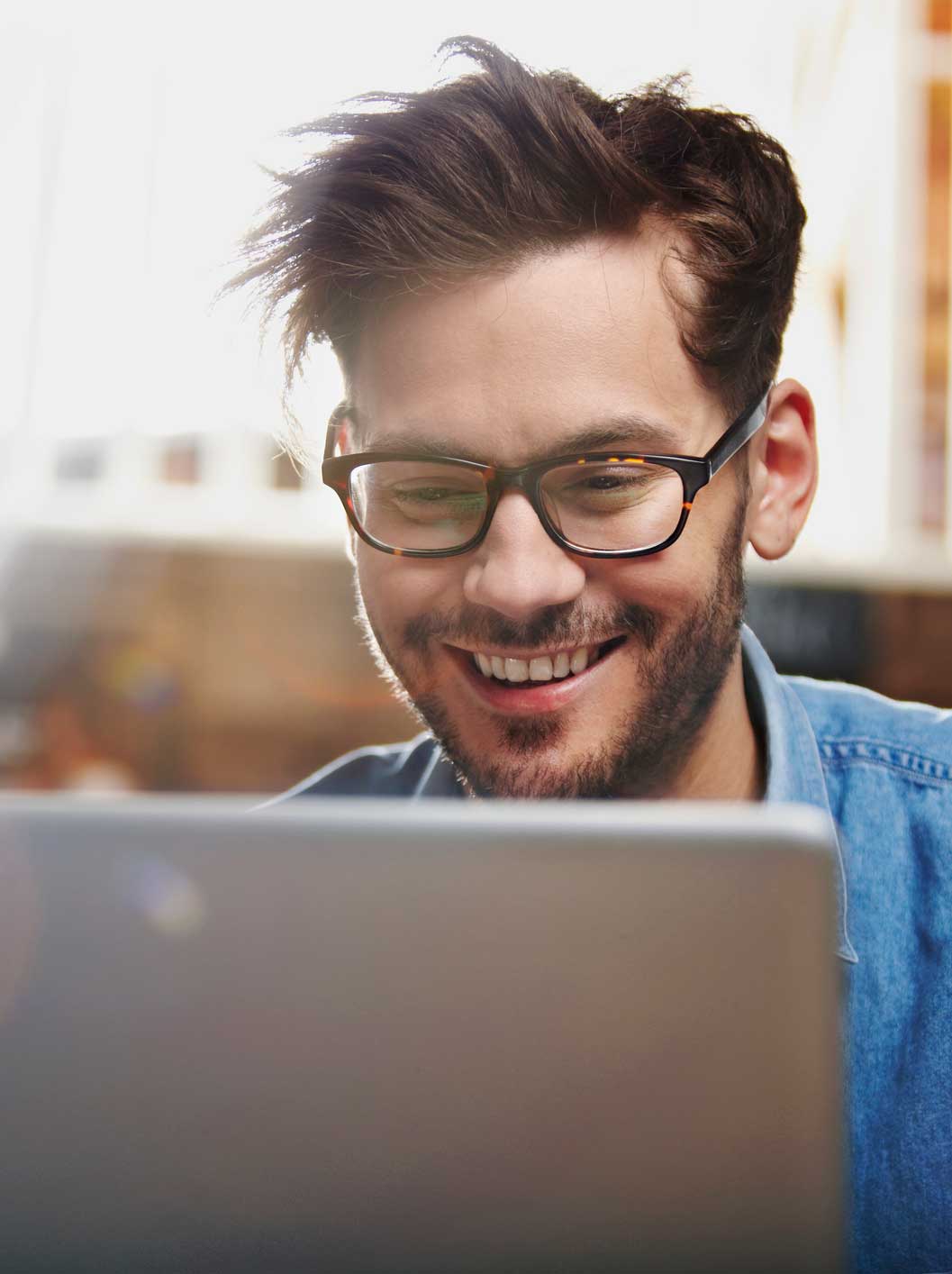 happy-person-looking-at-computer-screen