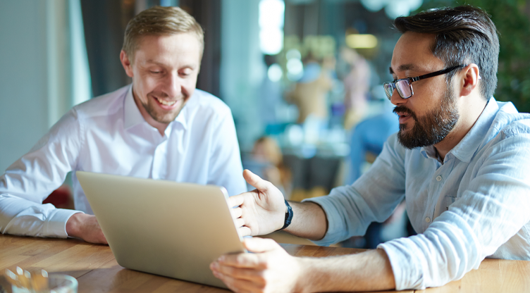 man comparing insurance options to customer