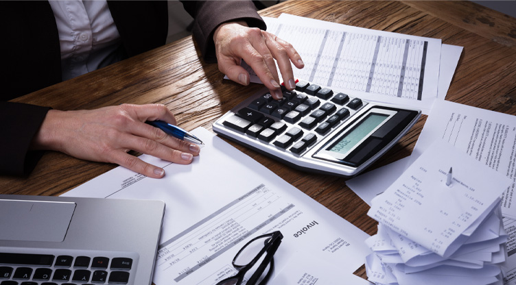 man paying taxes and looking at receipts