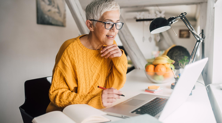 woman working at desk on computer